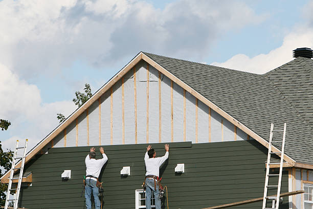 Professional Siding technician working in Summit, IL